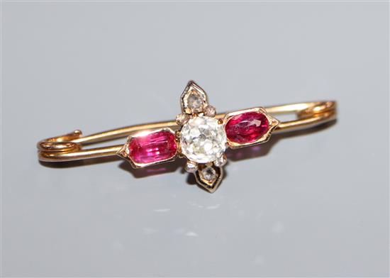 A late Victorian yellow metal, ruby and diamond cluster stick pin head, now converted to a brooch, 34mm.